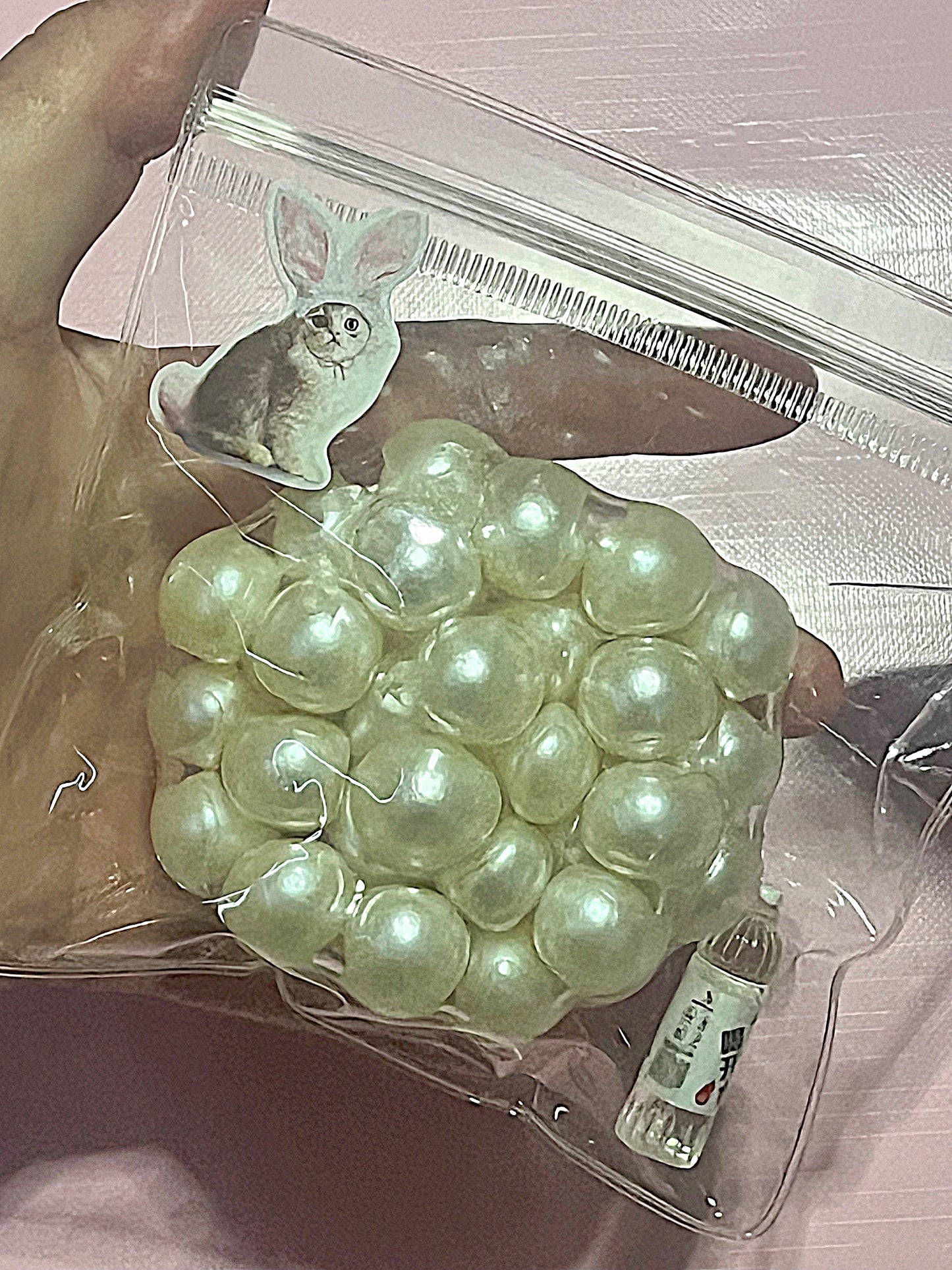 A demure pearl handmade stress ball